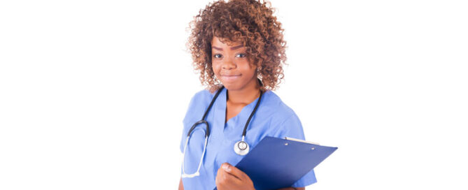 Healthcare professional holding a clipboard and wearing a stethoscope around her neck.