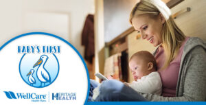 Woman smiling down at a baby lying and is lookingat her phone. In the foreground, there is a logo titled "Baby's First".