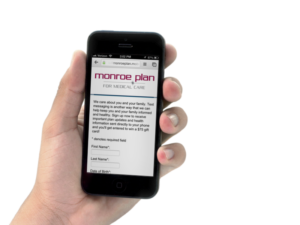 Monroe Plan for Medical Care Mobile Enrollment in Hand