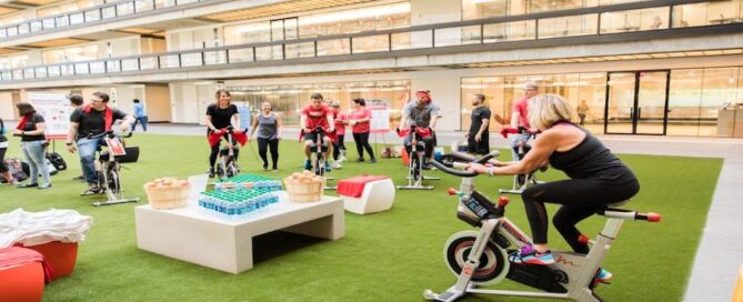 A group of people engaged in a spinning class CycleNation at BellWorks.