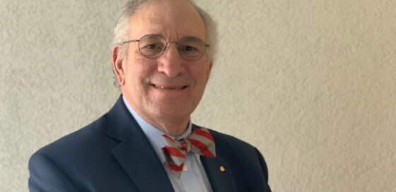 Older man in a gentle smile.