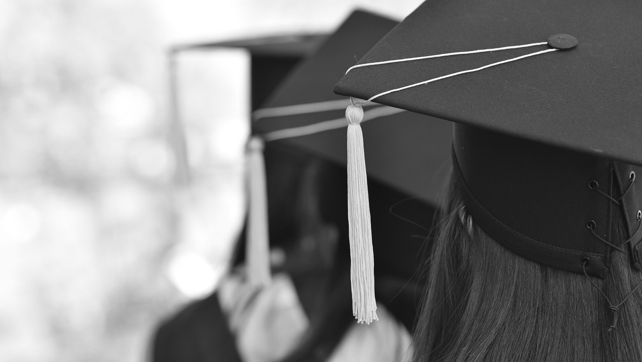 College Graduates in Caps and Gowns