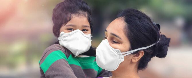 Mother and child wear facemask during coronavirus and flu outbreak.