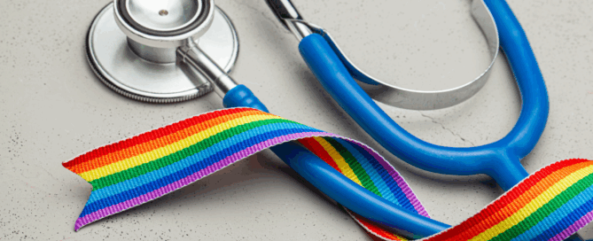 Stethoscope alongside a colorful rainbow ribbon, that represents pride and inclusivity.