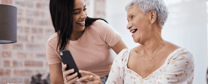 Two women smiling and enjoying a moment together.