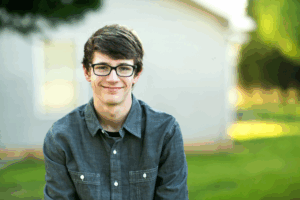 Man is smiling at the camera.