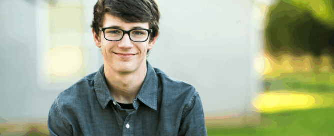 Man is smiling at the camera.