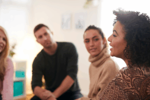 A woman speaking to a group.