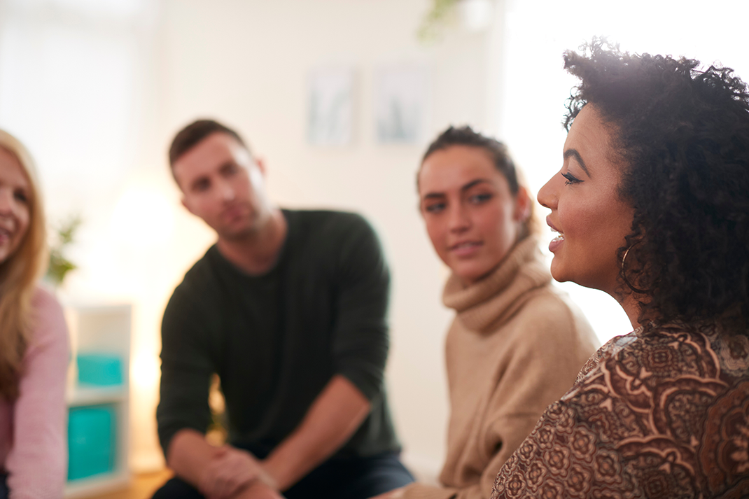 A woman speaking to a group. A woman speaking to a group.