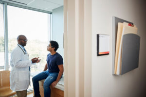 Doctor talking with male patient.