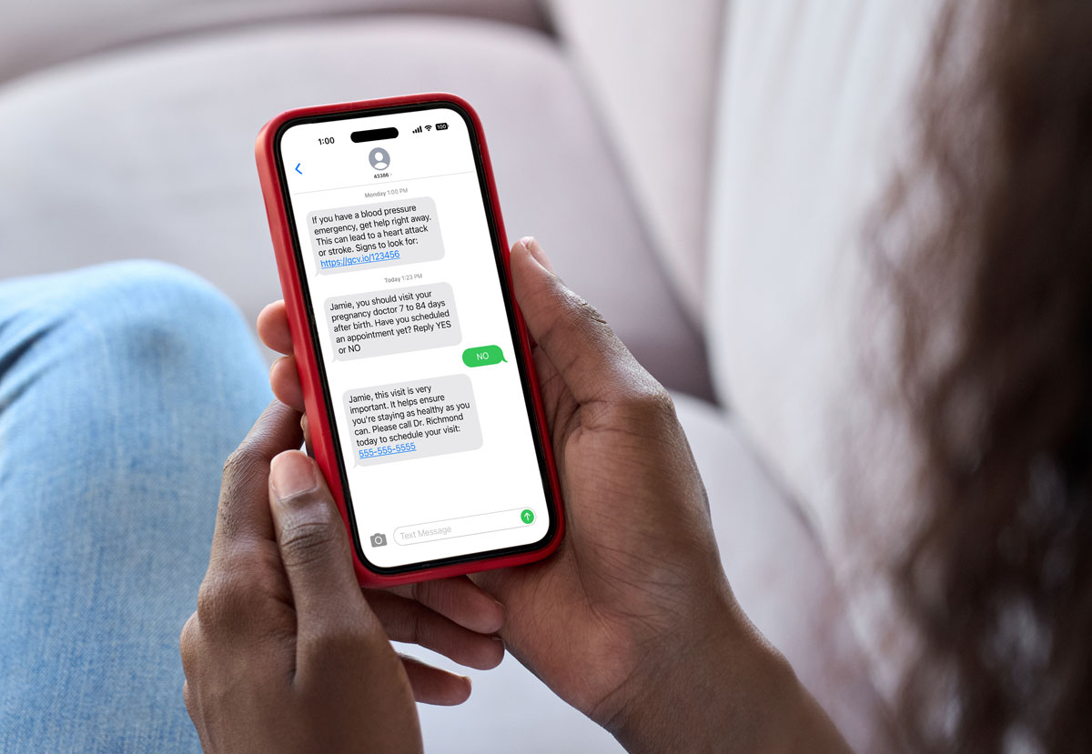 Young woman holding smart phone in hand.