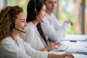 Happy colleagues in the call center office.