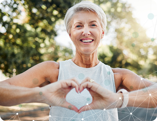 Mature woman making a heart gesture with her hands after running for health, wellness and workout outdoors.