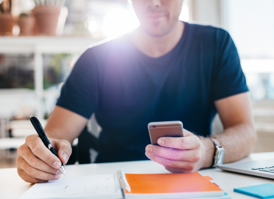 Man looking at his smart phone
